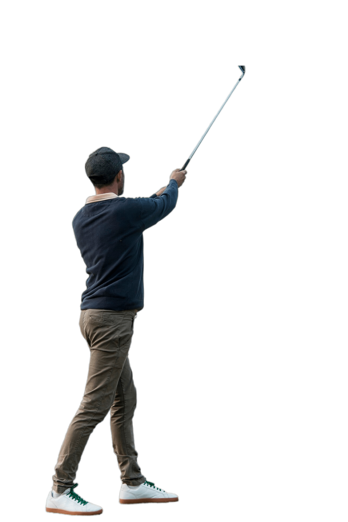 Joueur de golf frappant une balle avec un club.